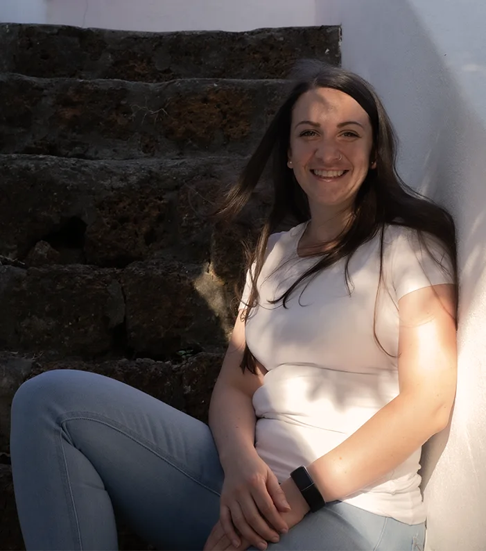 Carmen sitting on stone steps